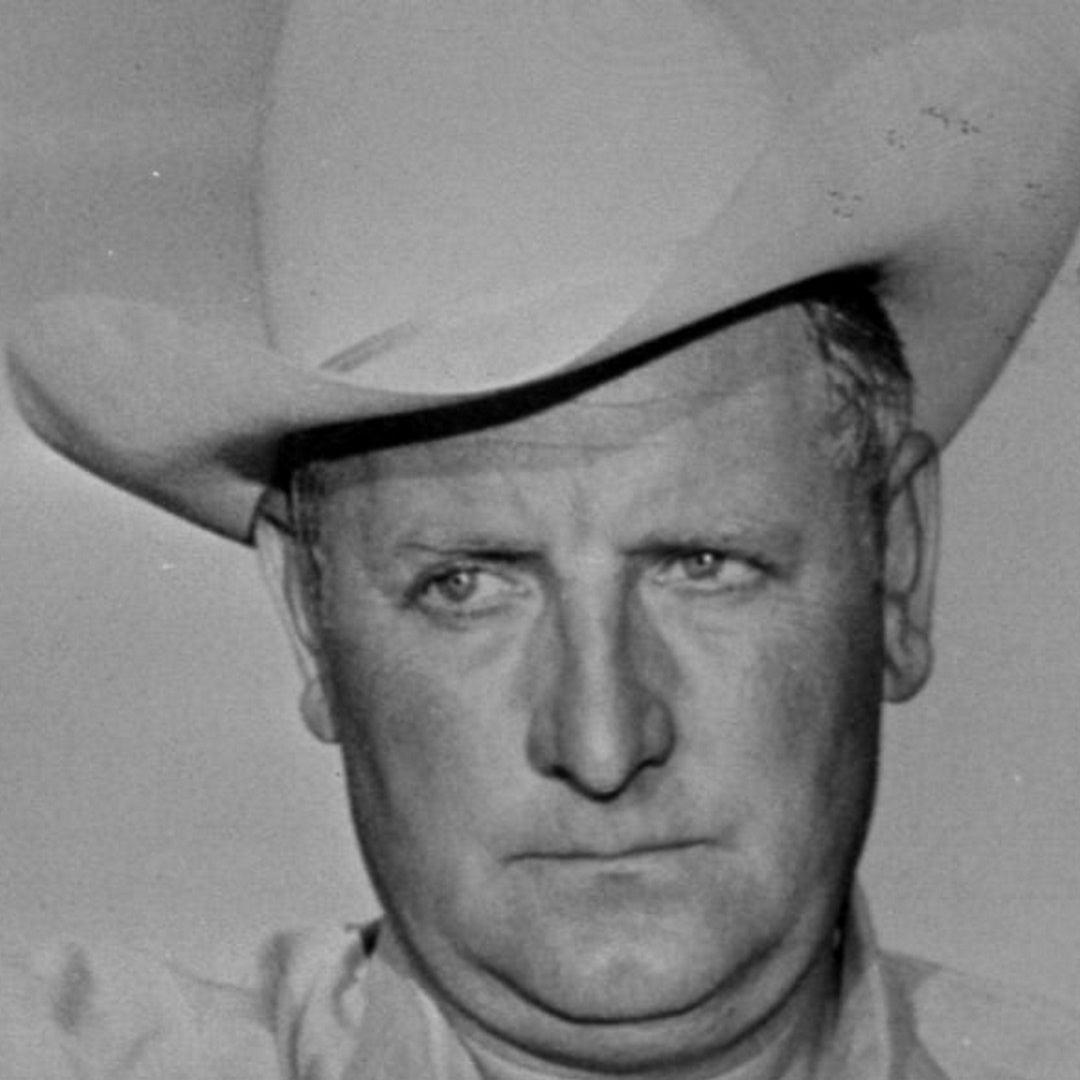 Black-and-white close-up portrait of Sheriff Ralph Lamb wearing a cowboy hat
