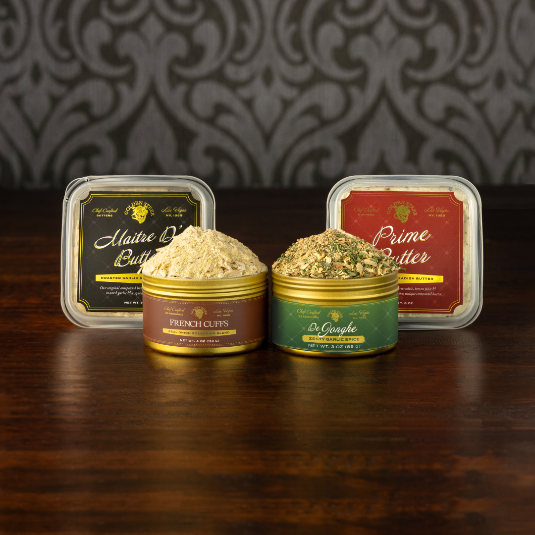 Gourmet seasoning tins 'French Cuffs' and 'De Jonghe Zesty Garlic Spice' with butter tubs 'Maitre D' Butter' and 'Prime Butter'.