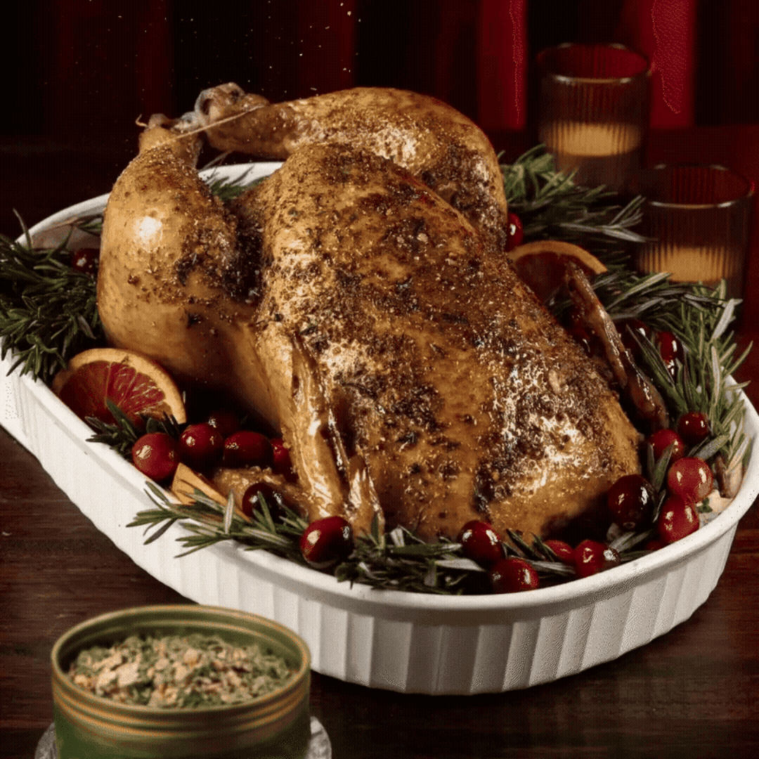 De Jonghe Seasoning sprinkling onto a roasted chicken