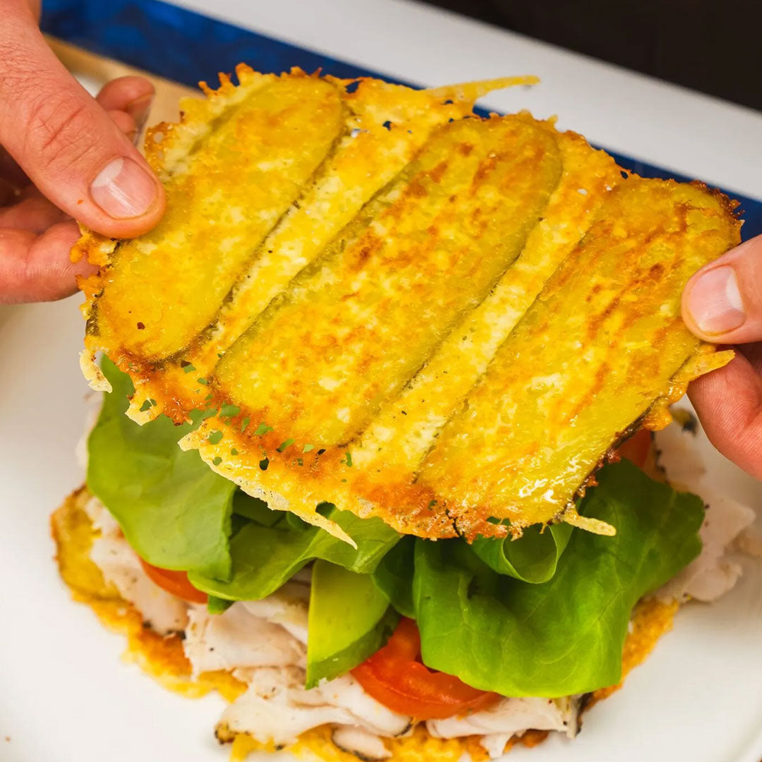 Pickle sandwich with crisped cheddar cheese and fried pickle slices bun, lettuce, tomato and sliced chicken